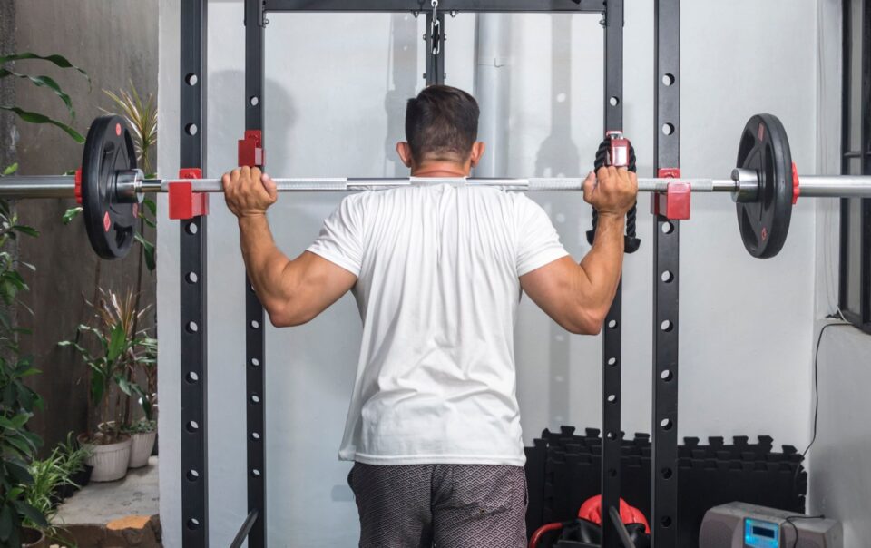 squat-stand-vs.-power-rack:-how-to-choose-your-gym's-command-center-–-breaking-muscle